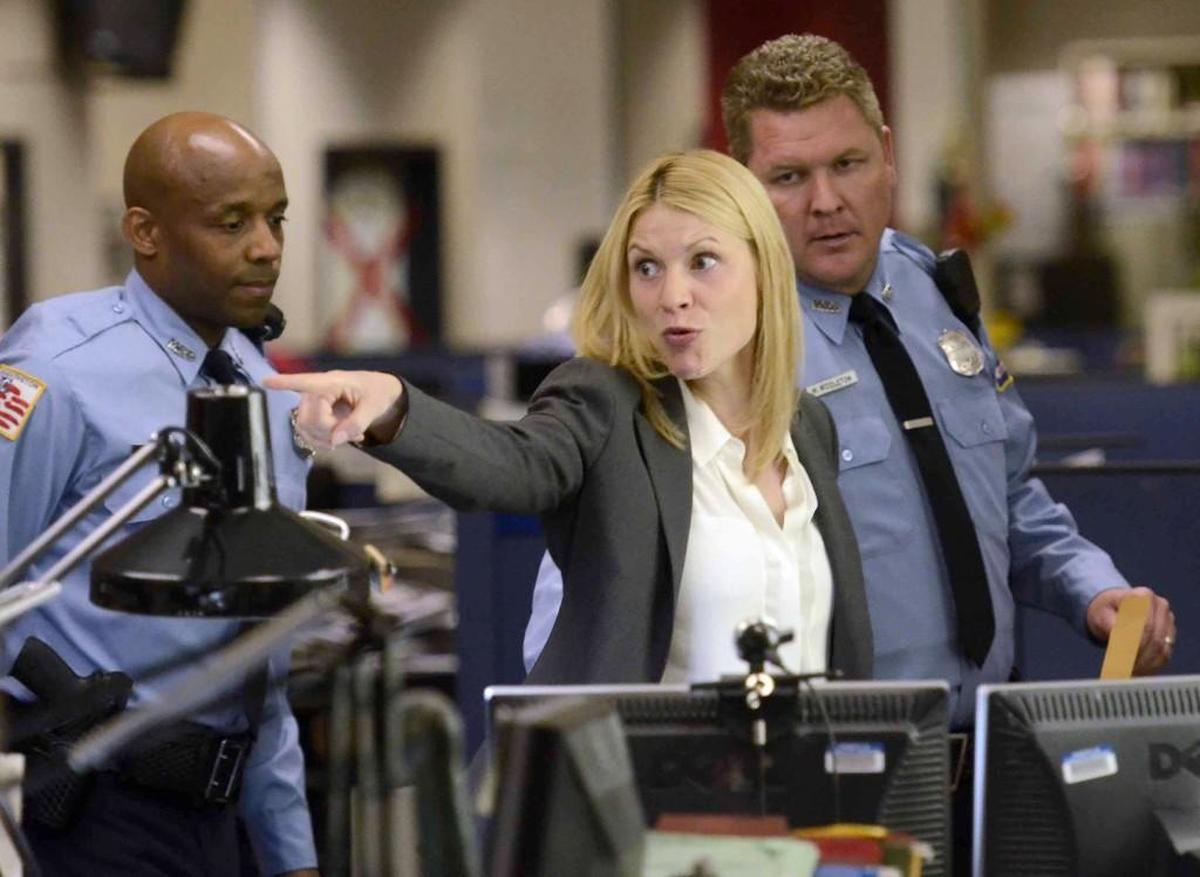 “Homeland” star Claire Danes rehearses a scene to be filmed in The Charlotte Observer newsroom in 2013. Three seasons of the Showtime series were filmed in Charlotte from 2011 to 2013.