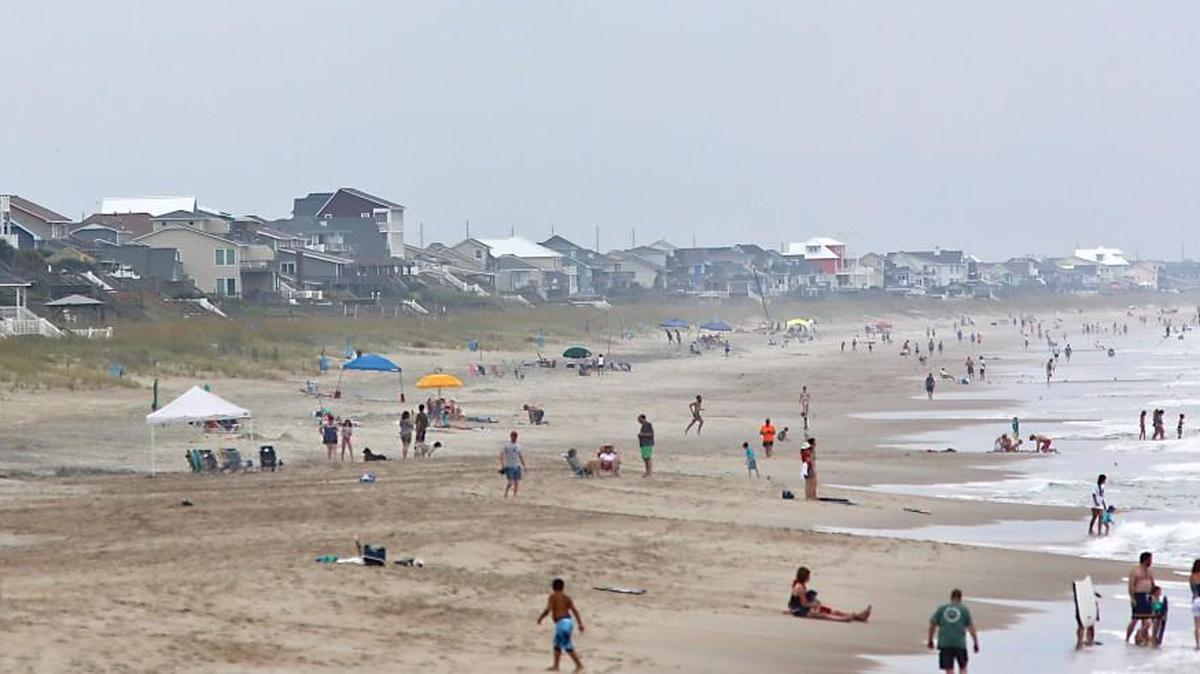 Beach-goers and residents enjoy the beach in Emerald Isle, N.C. on Monday, July 13, 2015.