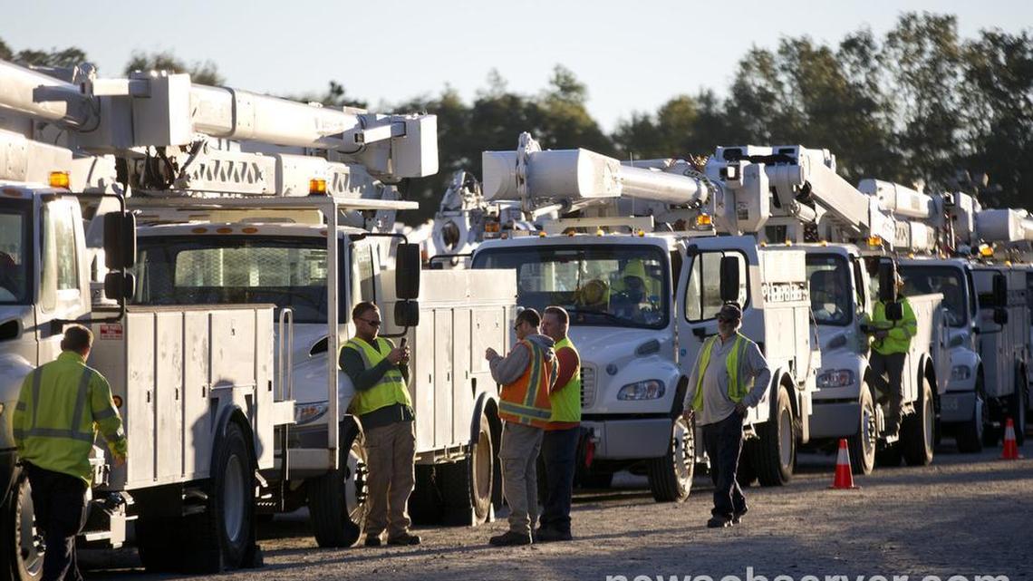 Trucks and crews contracted by Duke Energy prepare to head out to restore power across central N.C. Monday, October 10, 2016 at Coastal Credit Union Music Park at Walnut Creek in Raleigh, N.C.