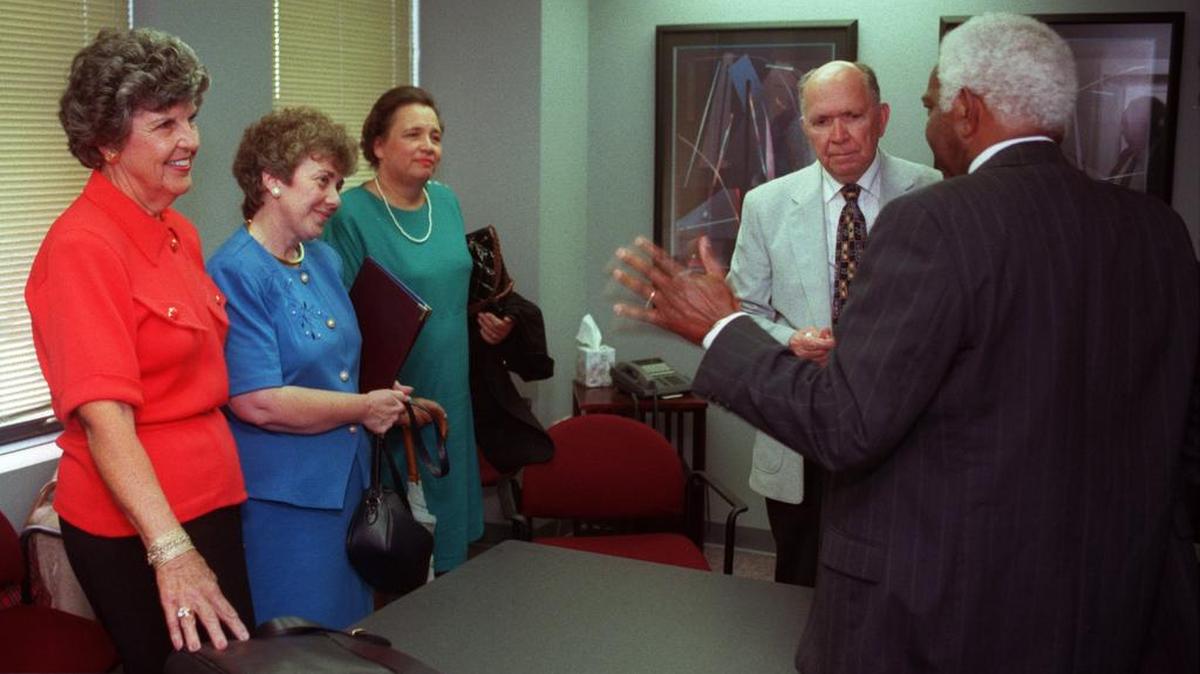 Roy Tilley, second from the right in this 1995 photo, was a leader in the 1976 merger of Wake County and Raleigh school districts and was the newly formed school board’s first elected chairman. Tilley died Tuesday at age 91.