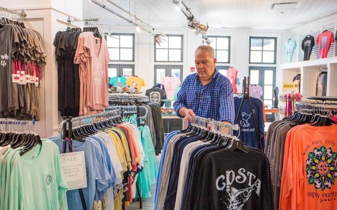 He chucked a 32-year career as an engineer to sell tees from a cart. Now he has 2 stores.