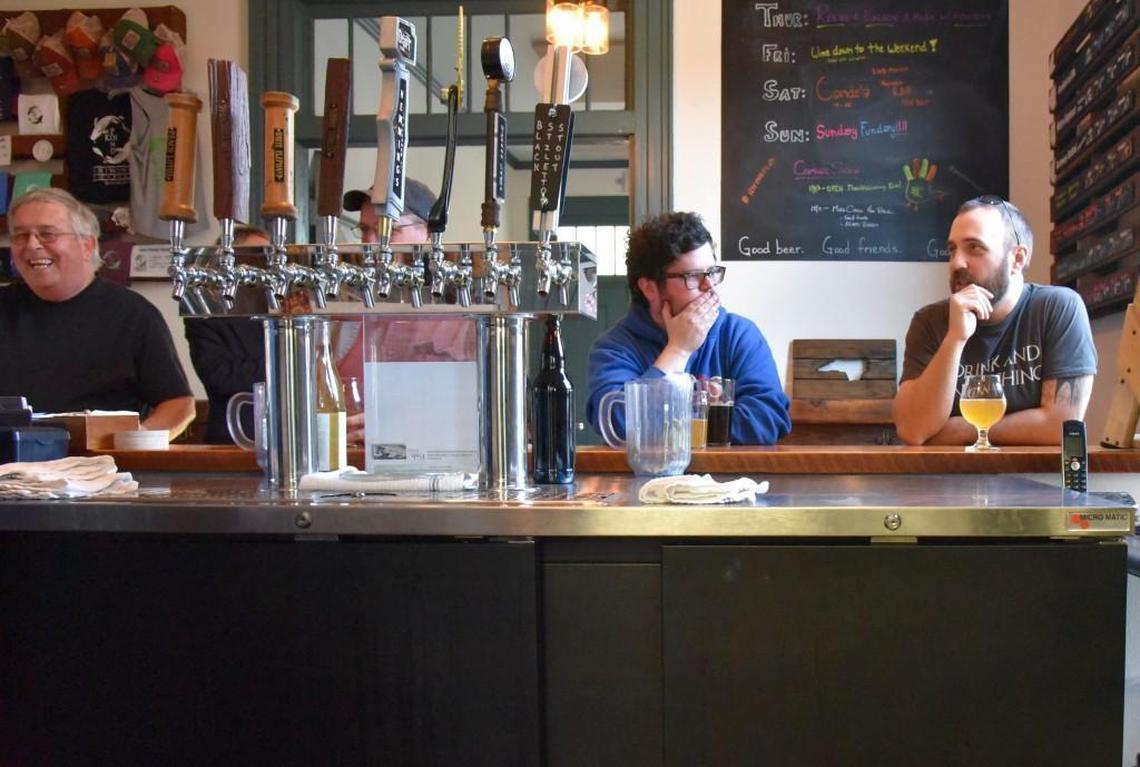 Customers enjoy a glass of beer at Rocky Mount Mills.