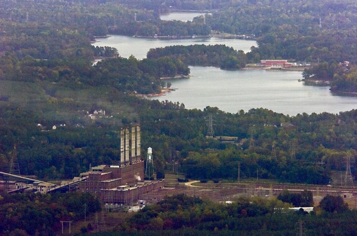 A file photo of Riverbend Steam Plant, with Mountain Island Lake visible. Duke Energy demolished the power plant and has excavated 5.4 million tons of coal ash once stored on its grounds.