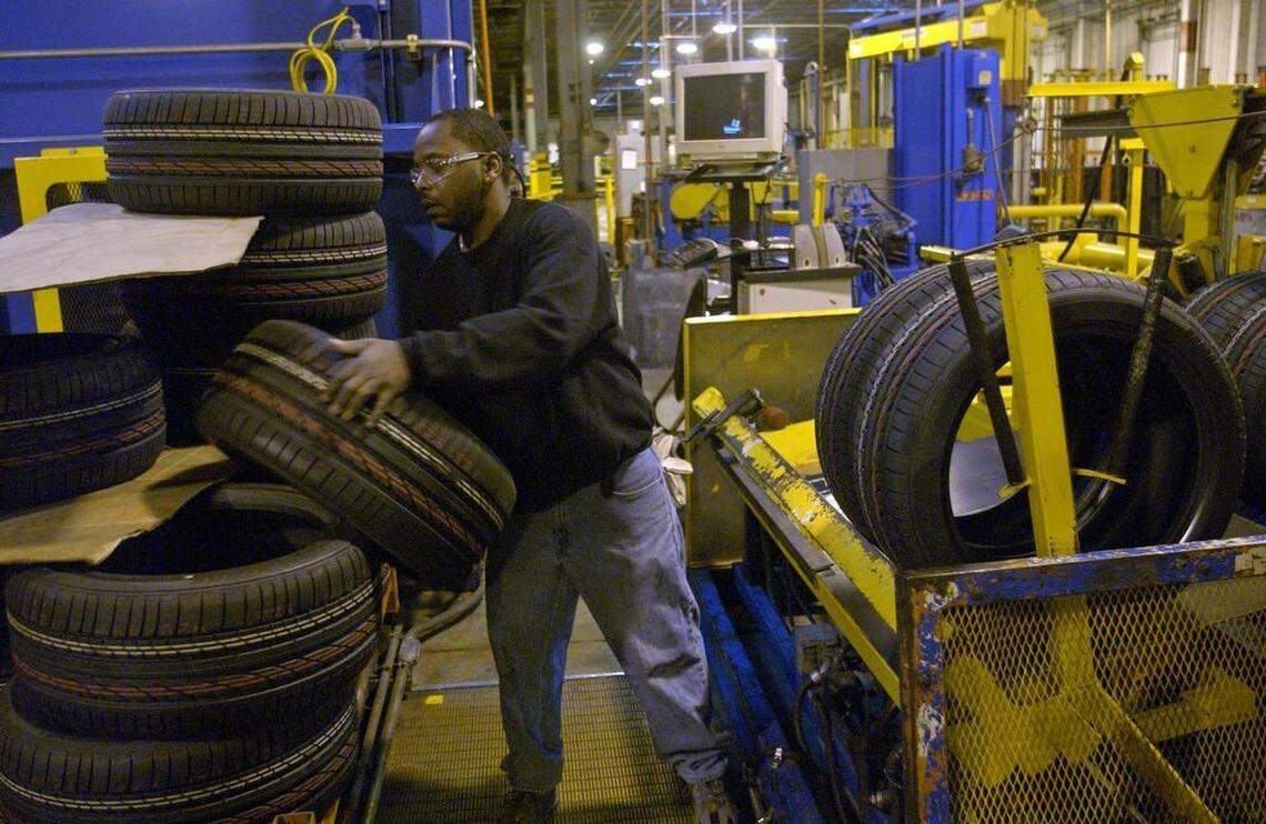 In this photo from 2007, Bobby Blue loads tires into a bundler machine at the Bridgestone Firestone plant in Wilson.