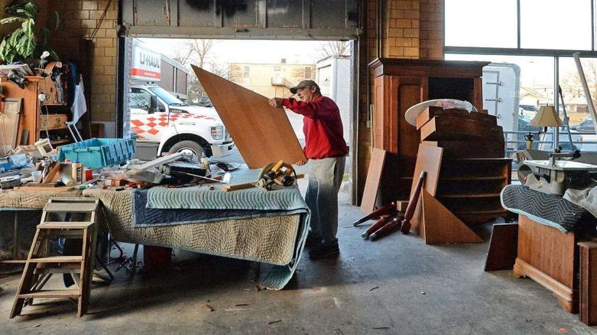 Shelton’s employee Stan Pruette makes some shelves out of discarded furniture parts Thursday, Dec. 15, 2016 in Raleigh, N.C. Shelton’s Furniture is leaving downtown Raleigh after 24 years because of redevelopment and high rents. The store is moving to downtown Clayton.