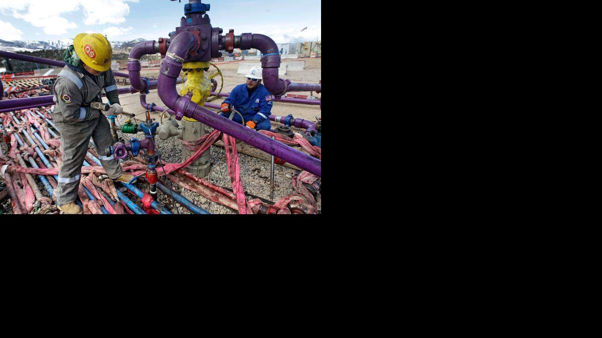 
Workers tend to a well head during a hydraulic fracturing operation in western Colorado in 2013. North Carolina has become the nation’s 34th state to allow such fracking operations to mine natural gas.

