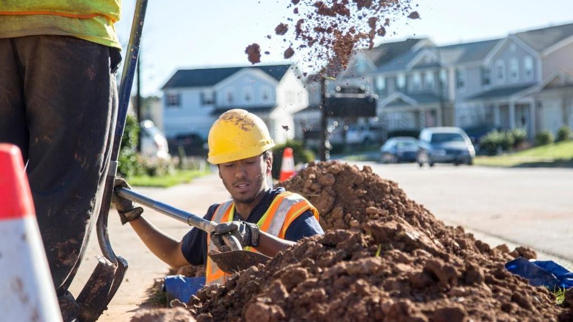 Workers lay fiber optic lines for high speed internet in Cary in December 2015. The city is the third-best internet-connected municipality in the U.S., according to a new survey.