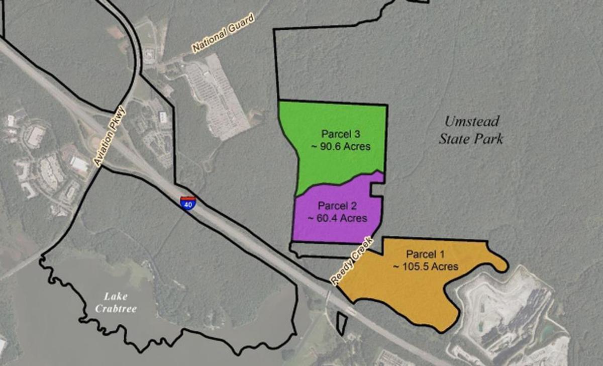Wake County leases parcels 2 and 3 on this map from the Raleigh-Durham Airport Authority. The 151 acres has about 7 miles of off-road cycling trails. The county wants to extend those trails north into an adjoining section of Umstead State Park.