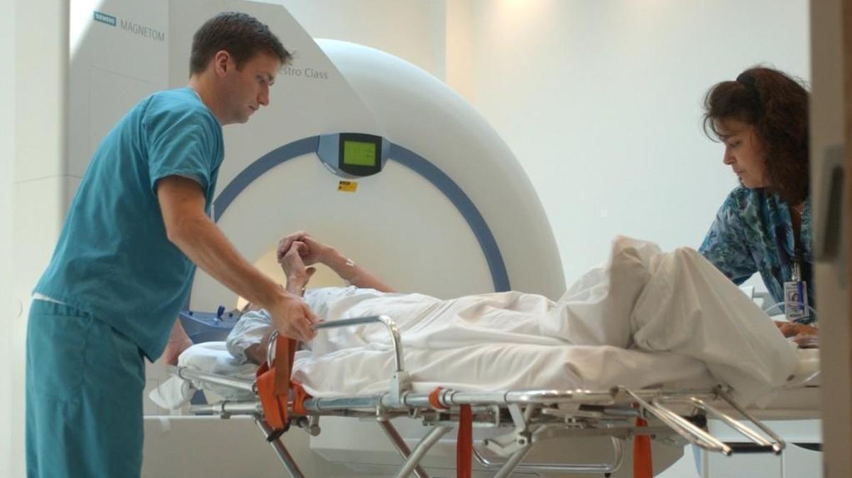 MRI technologists move a patient from a MRI scanner at Wake Medical Center. Under a new program introduced by Blue Cross and Blue Shield, patients could receive cash rebates for choosing cheaper MRI facilities.
