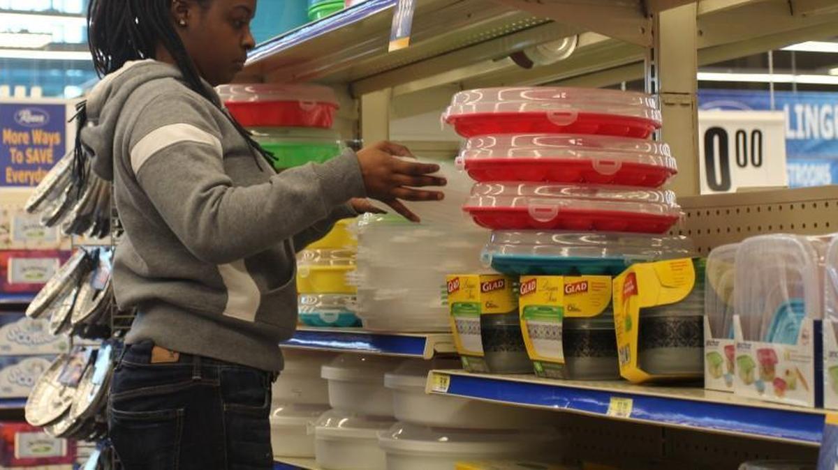 At the Roses in Southeast Raleigh, Aanae Locklear stocks shelves in 2015.