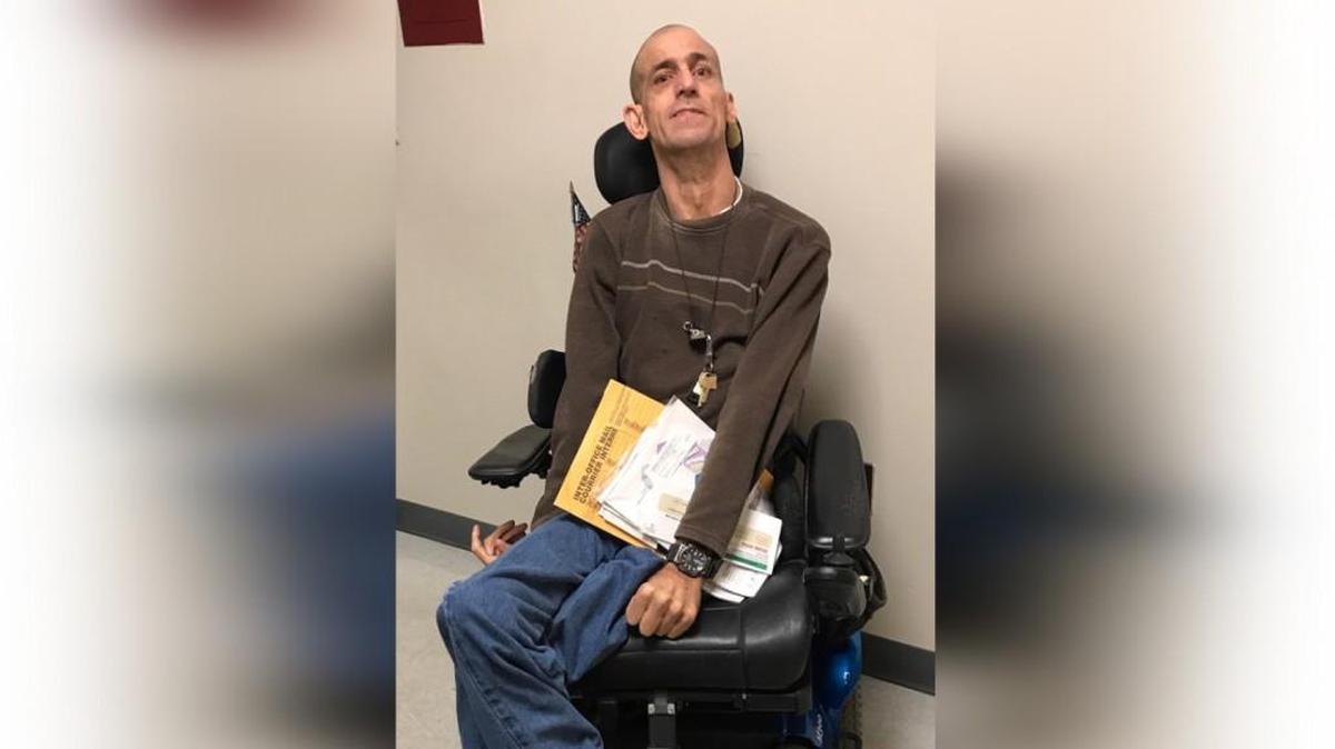 William Brinker works in the stock room and delivering packages at PPD in Wilmington. Brinker, who turned 50 this summer, says the job is a dream come true.