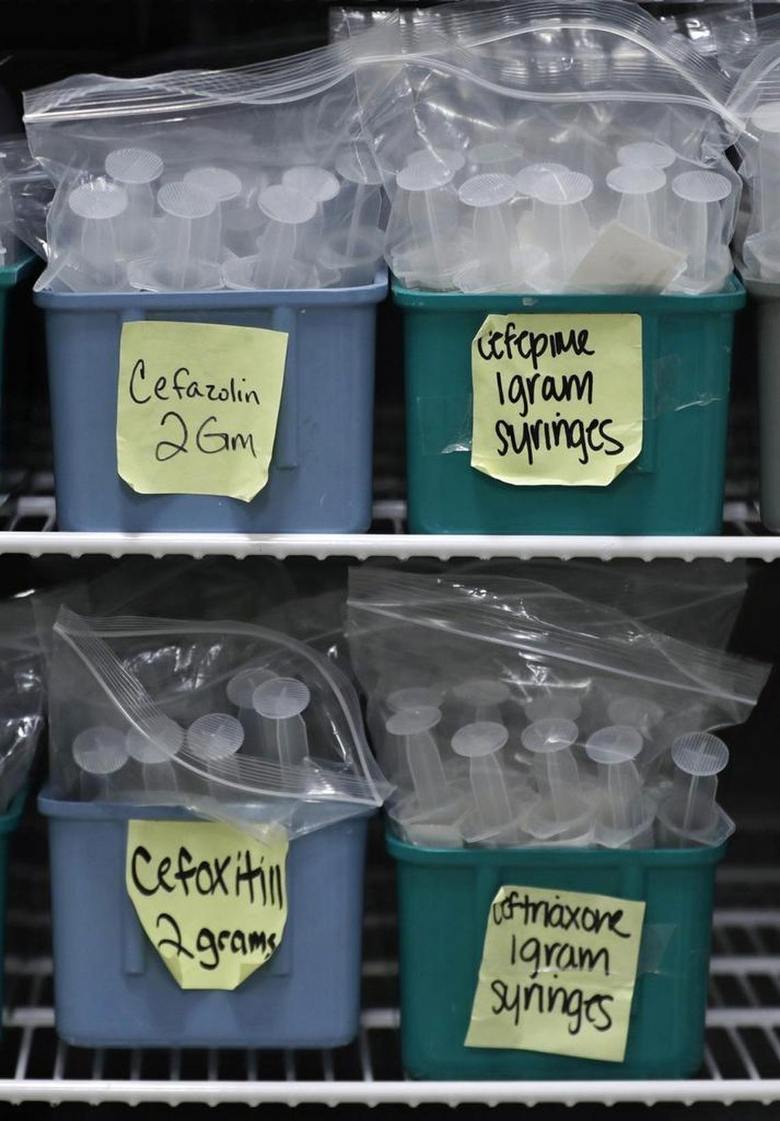 A refrigerator is filled with finished batches of stored syringes for IV pushes at a hospital in Toledo, Ohio. A national shortage of IV bags is causing hospitals in Raleigh, Durham and Chapel Hill to change the way they administer drugs and fluids to patients.
