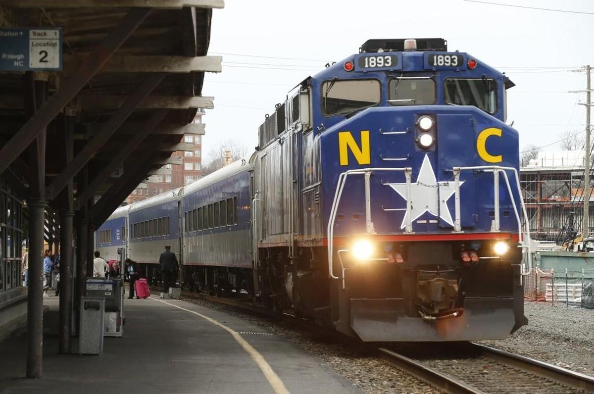 Passengers get on and off as the Amtrak Piedmont train coming from Charlotte stops in downtown Raleigh, NC on Jan. 17, 2017.  