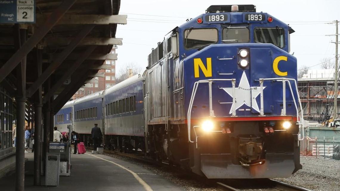Passengers get on and off as the Amtrak Piedmont train coming from Charlotte stops in downtown Raleigh, NC on Jan. 17, 2017.  