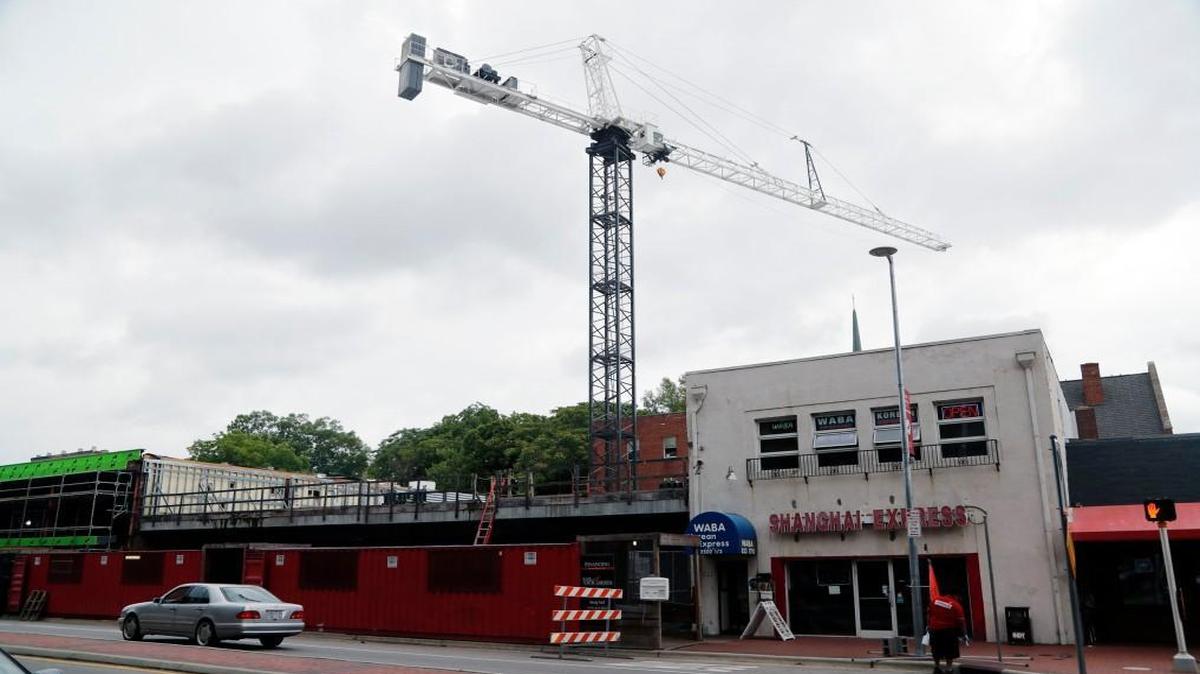 A crane sits atop the stalled construction site at 2504 Hillsborough St., across from NCSU in Raleigh on June 5, 2017. It’s near the corner of Hillsborough and Horne Streets.