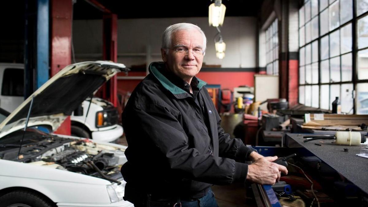 Barry Blinson at Calens Cars, the auto repair shop he owns in Wake Forest. Blinson and his wife have seen their health insurance rates soar because their income is too high to receive subsidies under the Affordable Care Act.