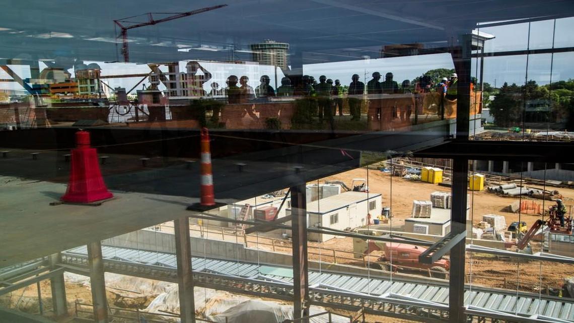Officials tour Raleigh’s Union Station, a transportation hub under construction in the warehouse district, on May 9. The city is in talks with York Properties, which is interested in managing commercial properties in the station.