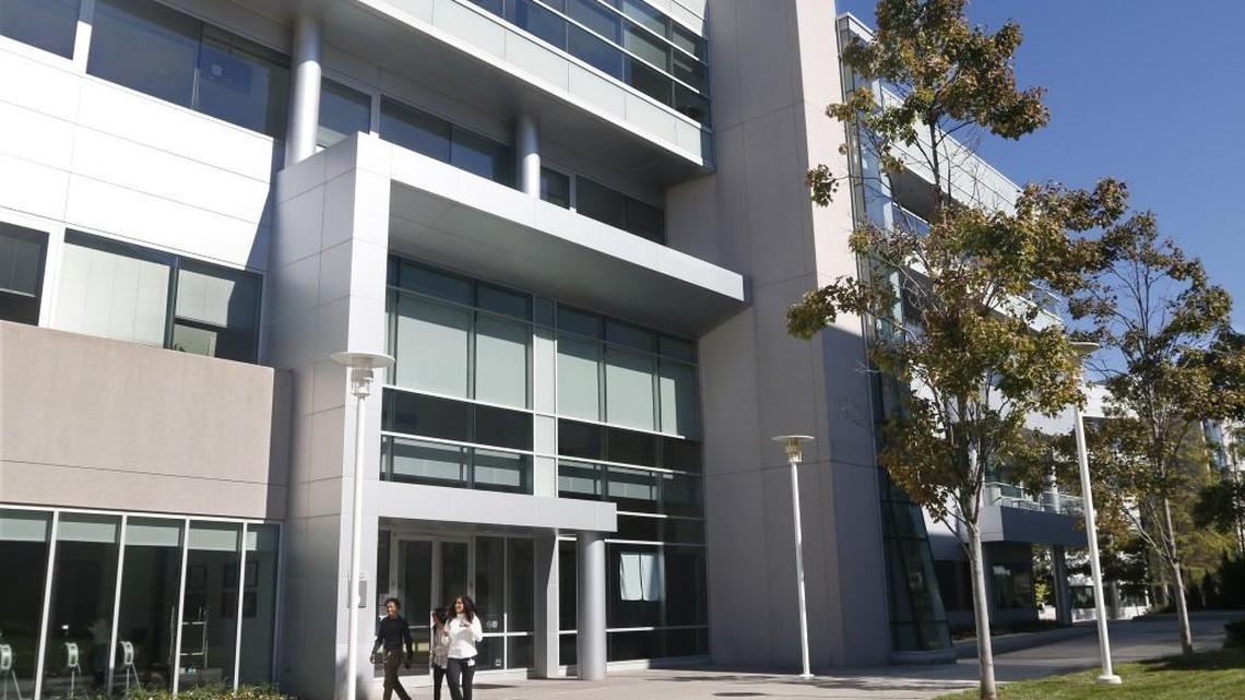 Cisco staff leave Building #9 on the Cisco campus off of Kit Creek Road in Morrisville. N&O File photo.