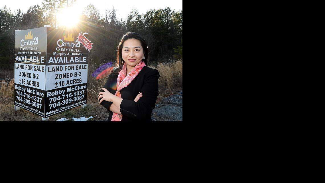 
Jane Wu, a Charlotte investor who is using a visa-based financing model for her development, is planning 300-unit upscale apartment complex here at 6919 N. Tryon St. along the Lynx Blue Line extension in the University City area.  In the University City area, a proposed mixed-use development near the light-rail extension is typical enough. But its source of funding is not: Chinese investors who want a U.S. visa in exchange for $500,000. The EB-5 program is perfectly legal and exploding in popularity. Congress created the program in 1990 to stimulate the U.S. economy with more foreign investment.
