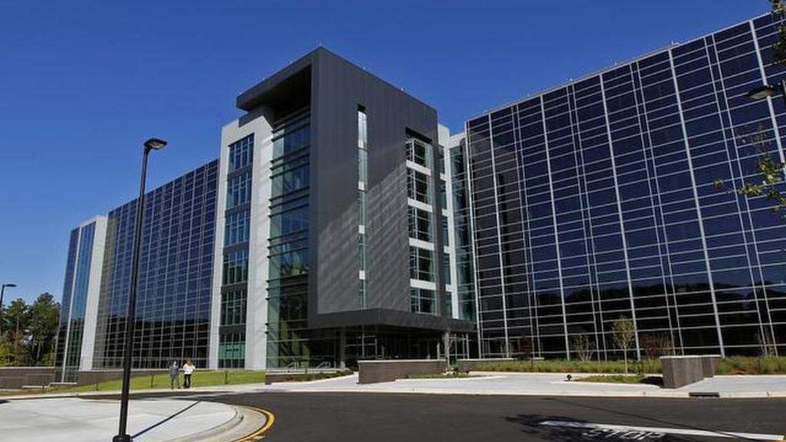 
Glass gleams on the new "Q" Building that Gov. Pat McCrory and SAS CEO Jim Goodnight dedicated on the SAS campus in Cary in this October 2014 file photo.
