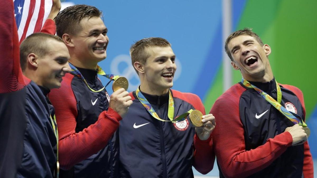 N.C. State swimmer Ryan Held, third from left, and the rest of the United States men's 4x100-meter freestyle relay team, from left, Caeleb Dressel, Nathan Adrian and Michael Phelps, celebrate after winning the gold medal at the 2016 Summer Olympics Aug. 8, 2016, in Rio de Janeiro, Brazil.