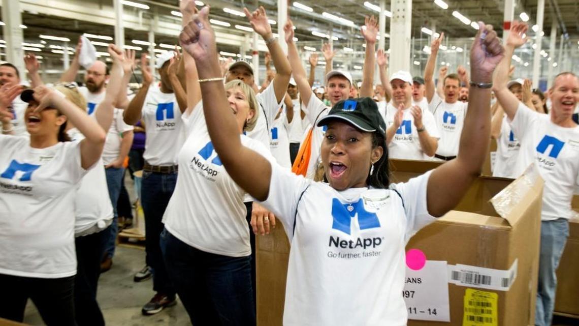 NetApp employees including Regina Evans, of Clayton, center, cheer as Gov. Pat McCrory announces them as one of the volunteer groups participating in the Sort-a-Rama on Sept. 11.