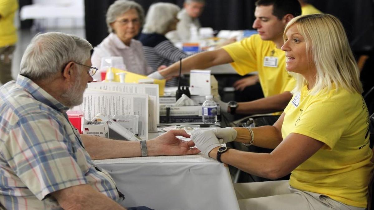 Community health specialists from WakeMed check the blood pressure, cholesterol levels and glucose levels of Wake County residents in this file photo. WakeMed Health and Hospitals was among the 654 North Carolina employers who participated in an annual survey about health care costs and benefits.