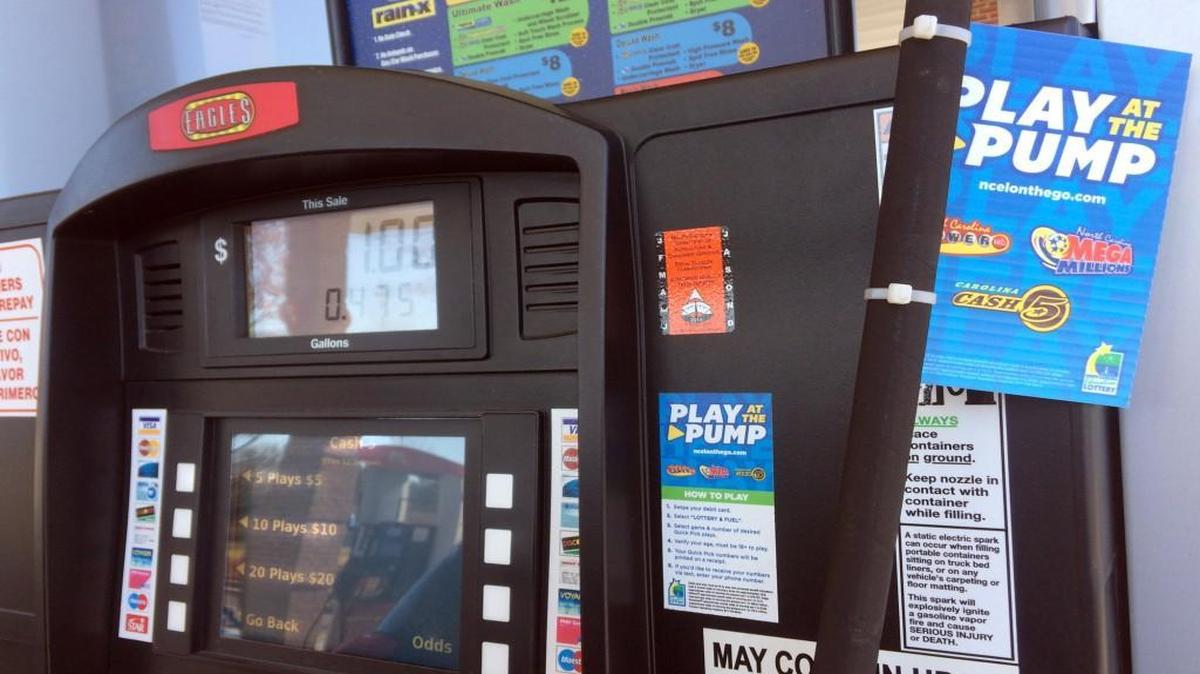 A Play at the Pump lottery screen on a pump at the Eagles Gas Station on Tryon Road in Raleigh.