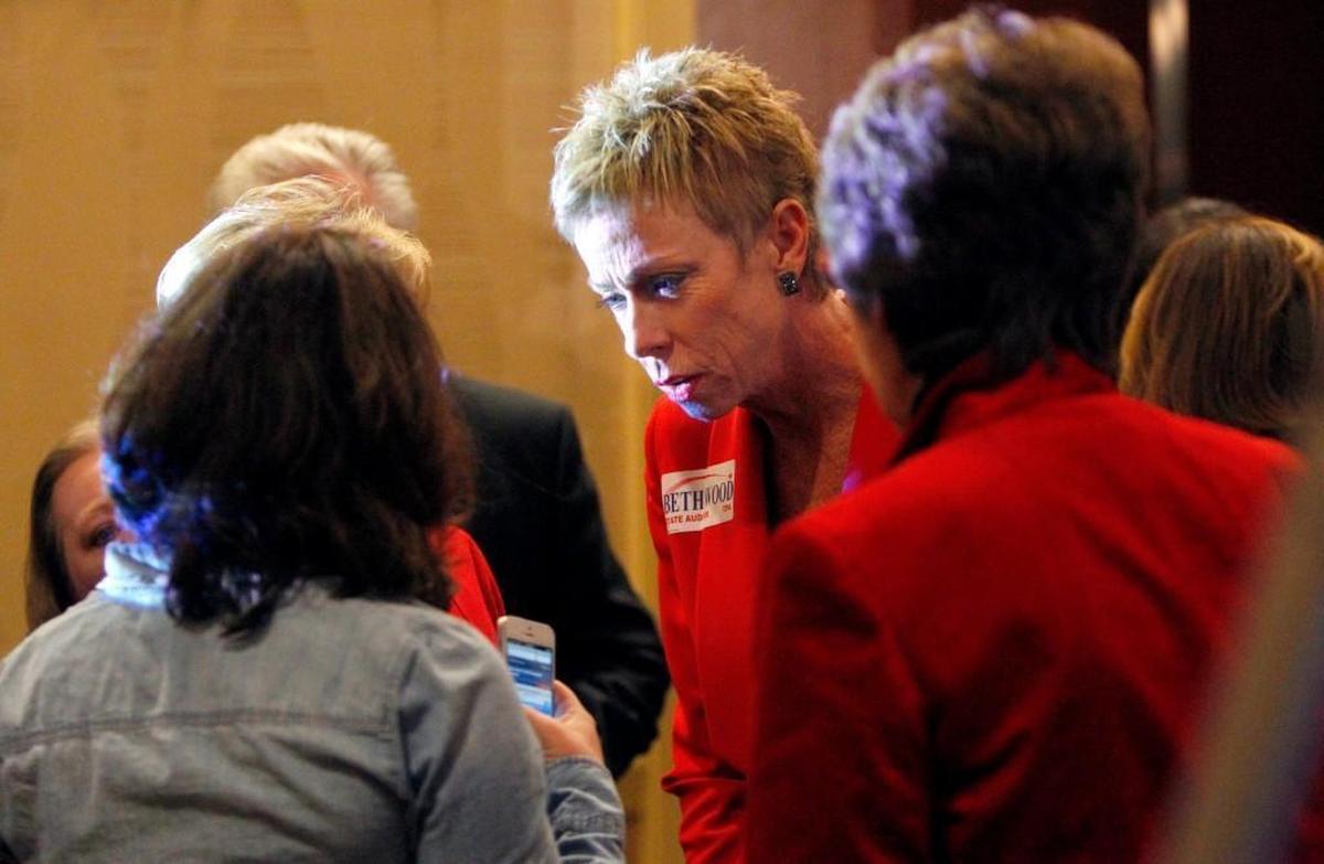 State Auditor Beth Wood, center, talks with former N.C. Senator Kay Hagan, left, in 2012 at the Marriott City Center Hotel in Raleigh. After money went missing at the Wake County Register of Deeds, Wood said on Jan. 17, 2018 that she fears other counties may be placing unwarranted trust in annual audits.