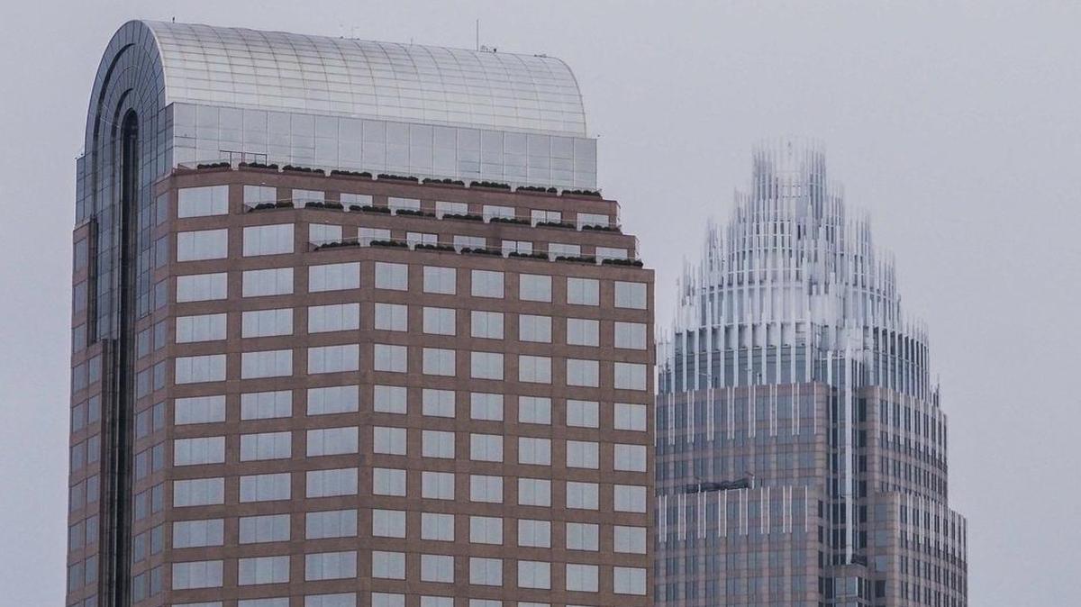
Wells Fargo and Bank of America tower over uptown Charlotte. A little-noticed provision in North Carolina’s Senate budget could drive bank traders out of Charlotte – along with their multi-million dollar payrolls – a Mecklenburg County lawmaker warned Thursday.
