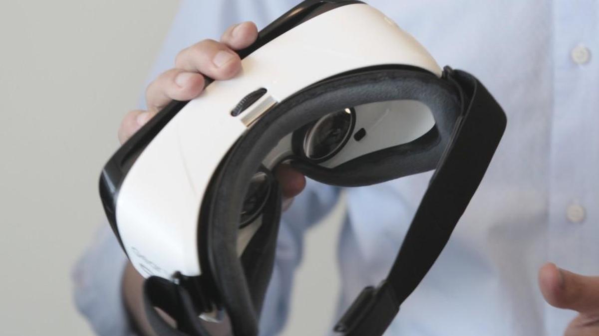 Jason Cooper, director of multimedia for Horizon Productions in Durham holds a pair of virtual reality goggles.