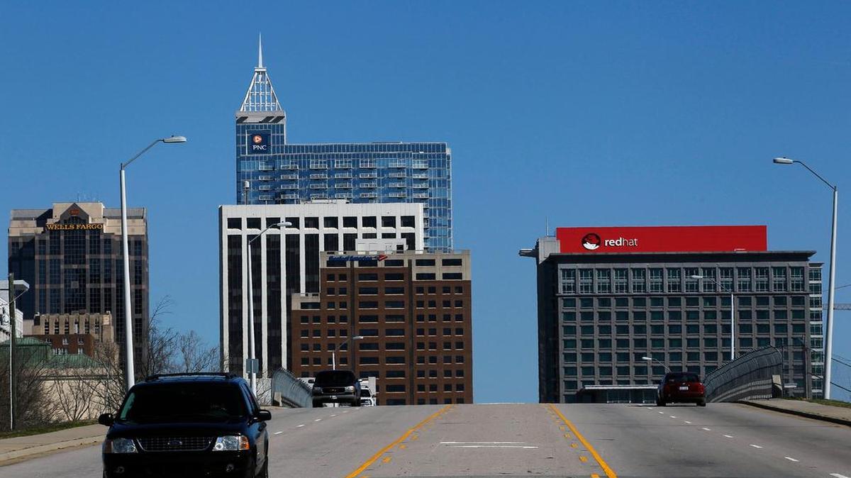 
The Red Hat building sign looms large on the Raleigh skyline in 2014. Keeping Red Hat was a win for the city.
