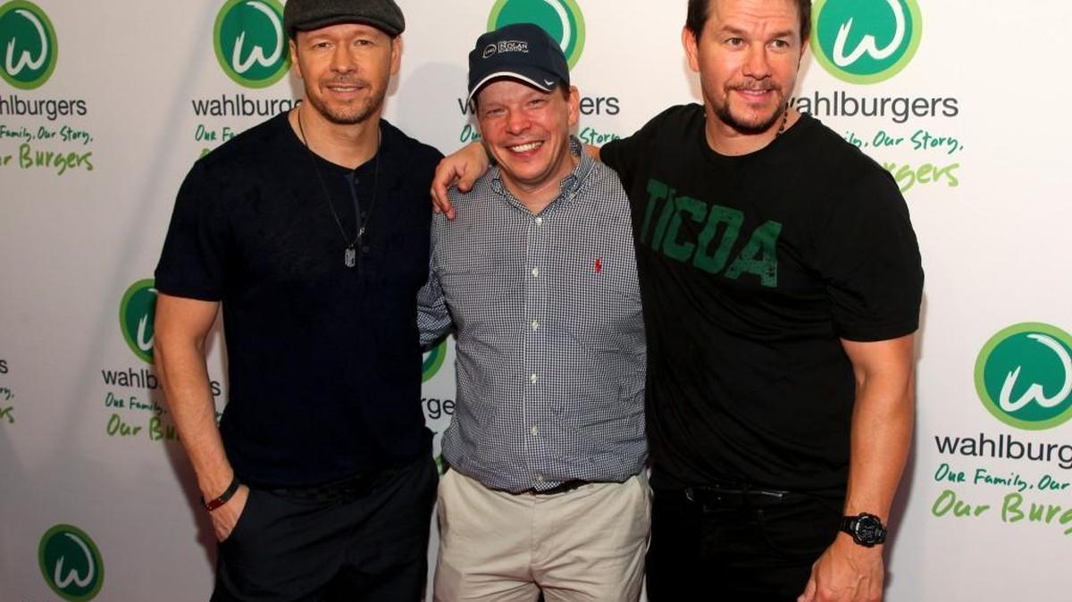 Donnie Wahlberg, from left, Paul Wahlberg and Mark Wahlberg attend the Wahlburgers Coney Island preview party in New York, June 23, 2015.