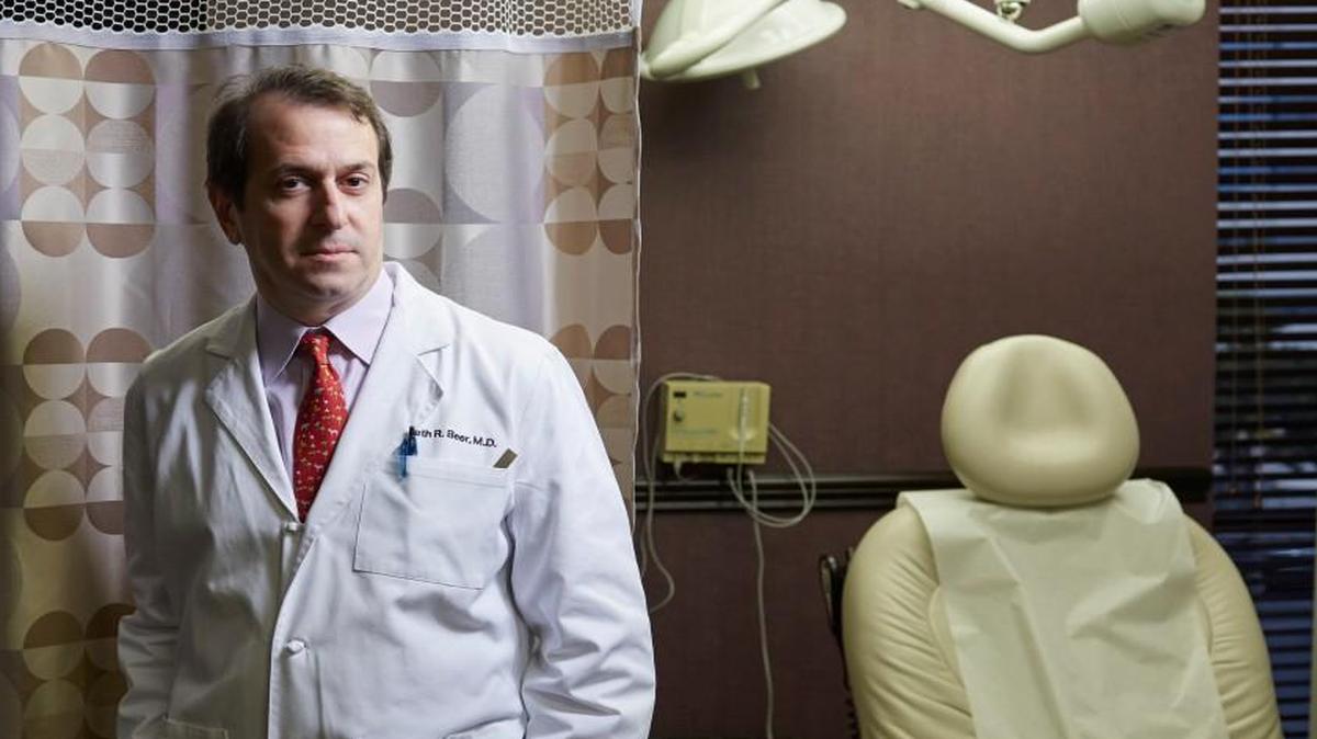 Dr. Kenneth Beer, a dermatologist, at his office in West Palm Beach, Fla., Oct. 19, 2015. The use of speciality pharmacies affiliated with drug companies seem to have become a new way of trying to keep the health system paying for high-priced drugs. “They are all trying to get rid of the sticker shock of using their drugs,” Beer said.