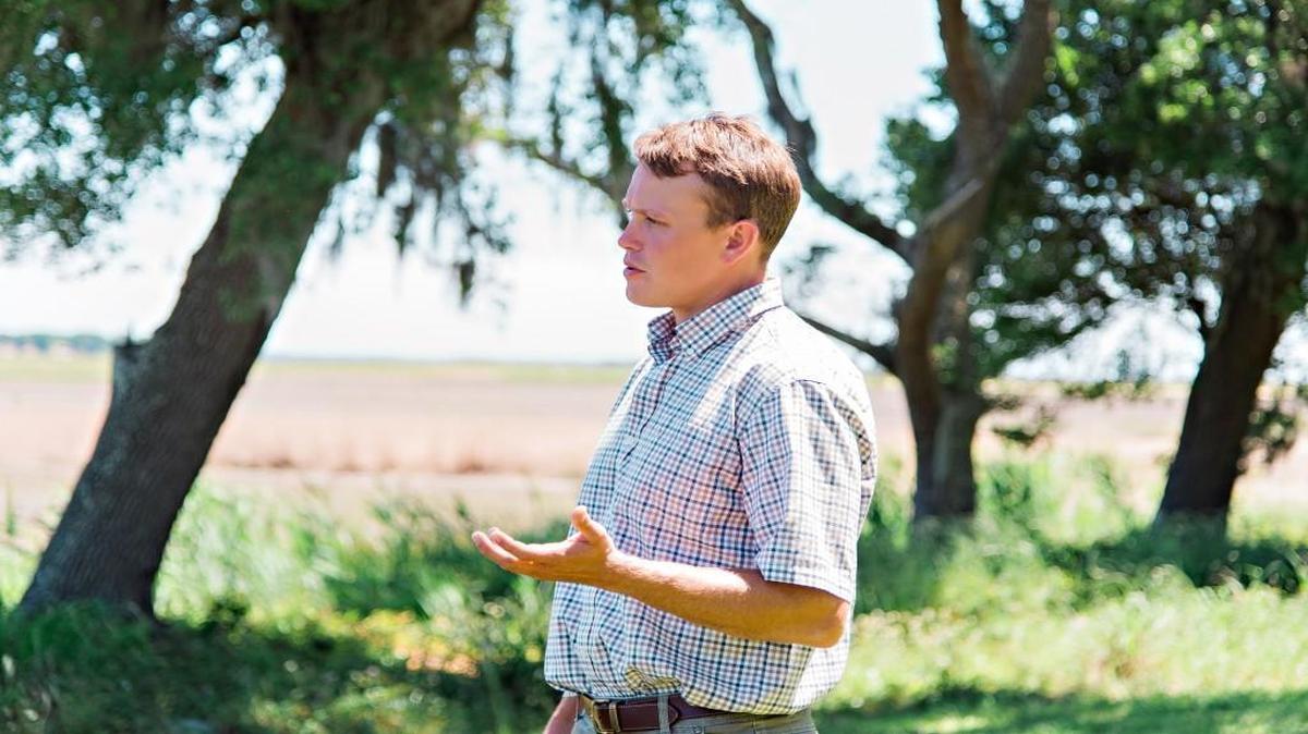 Dillon Epp, who manages the restoration of the rice fields at the Orton Plantation.