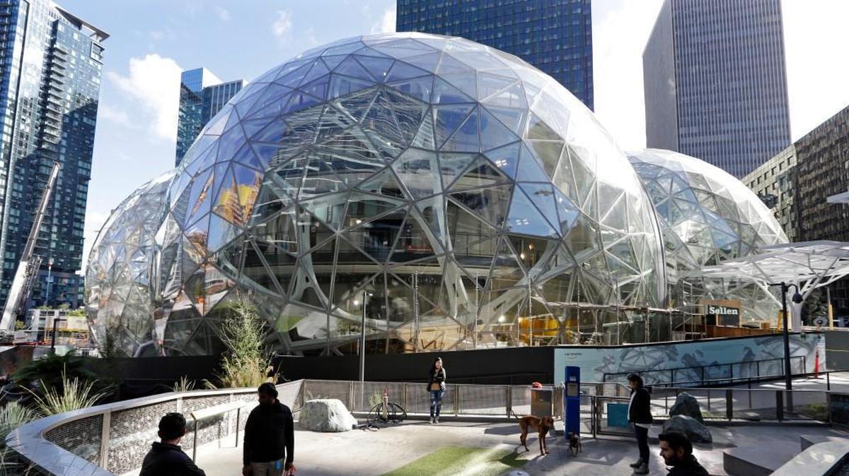 Part of Amazon’s presence in Seattle includes large spheres and a dog park. The company has exceeded its growth projections in Seattle.