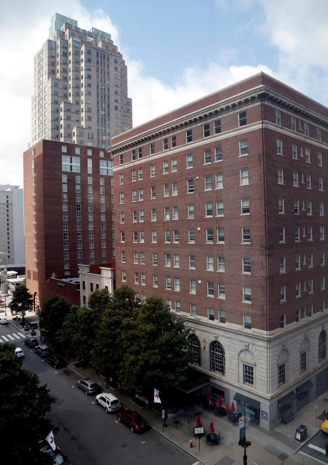 The Sir Walter Apartments, right, which currently is home to older, low income people, is slated to be sold to an Ohio- based company that says the residents will have to be out by 2020. The building is near the Sheraton Hotel, left, and BB&T Building, top, in downtown Raleigh on June 19, 2017. Fayetteville Street runs in the left foreground.