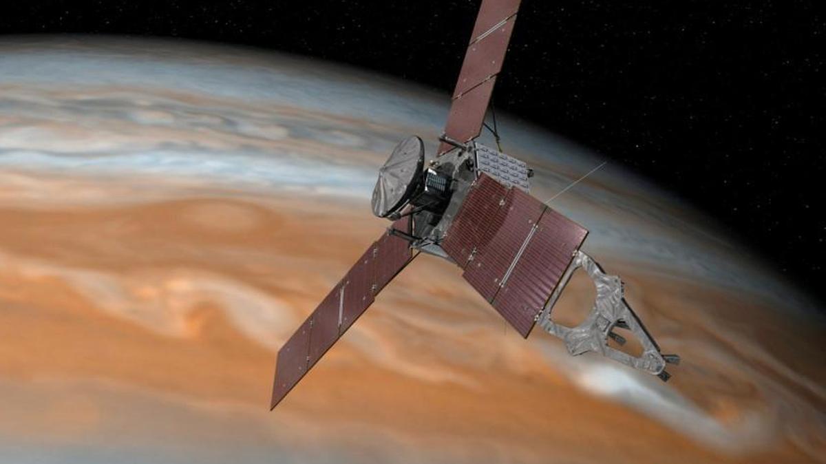 This artist's rendering provided by NASA and JPL-Caltech shows the Juno spacecraft above the planet Jupiter. Five years after its launch from Earth, Juno is scheduled to go into orbit around the gas giant on Monday, July 4, 2016.