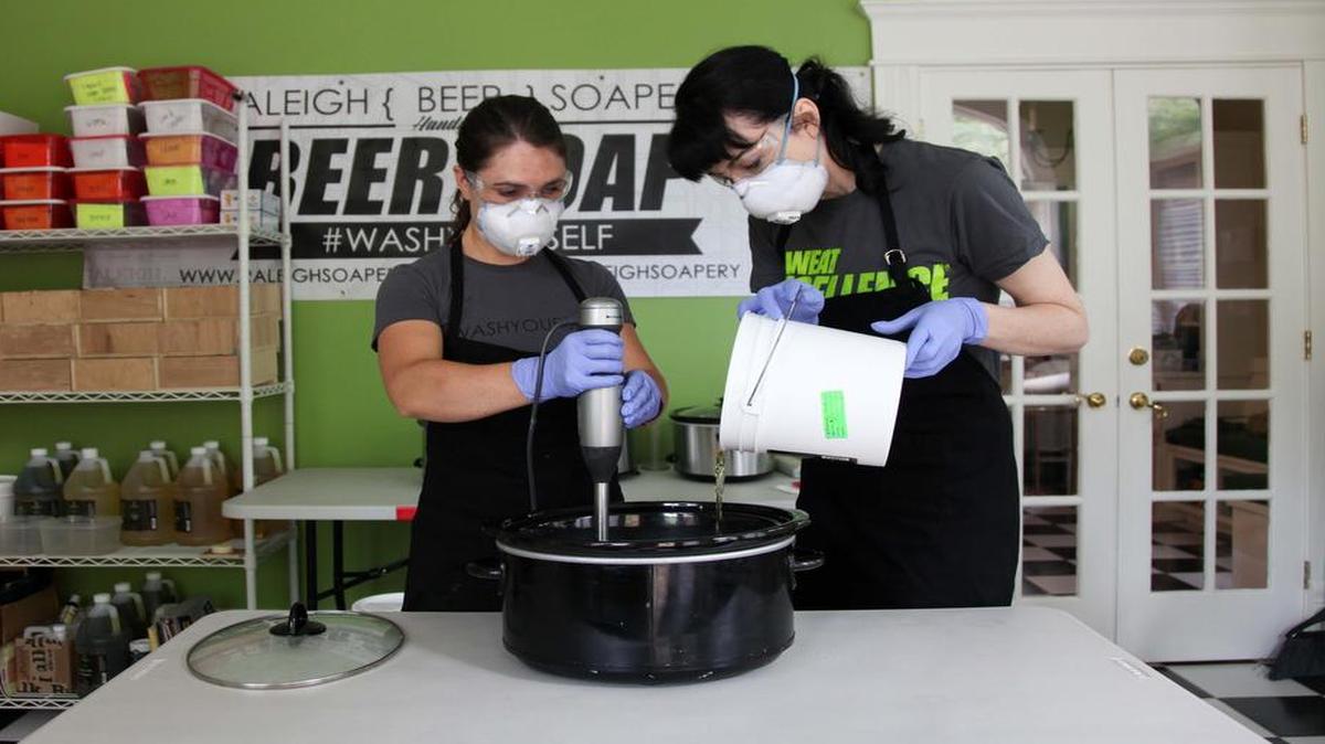 Megan Patton, left, and Megan Edge make soap using locally made beer and other ingredients Aug. 31. The pair started Raleigh Soapery last year, and now the company partners with local breweries.