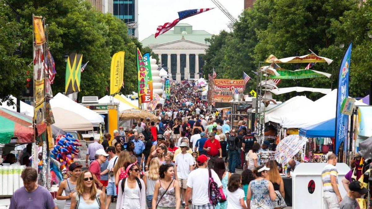 Guests of downtown Raleigh's annual Independence Day celebration, called The 'Works, fill the length of Fayetteville Street on Saturday afternoon July 4, 2015 in Raleigh, N.C.