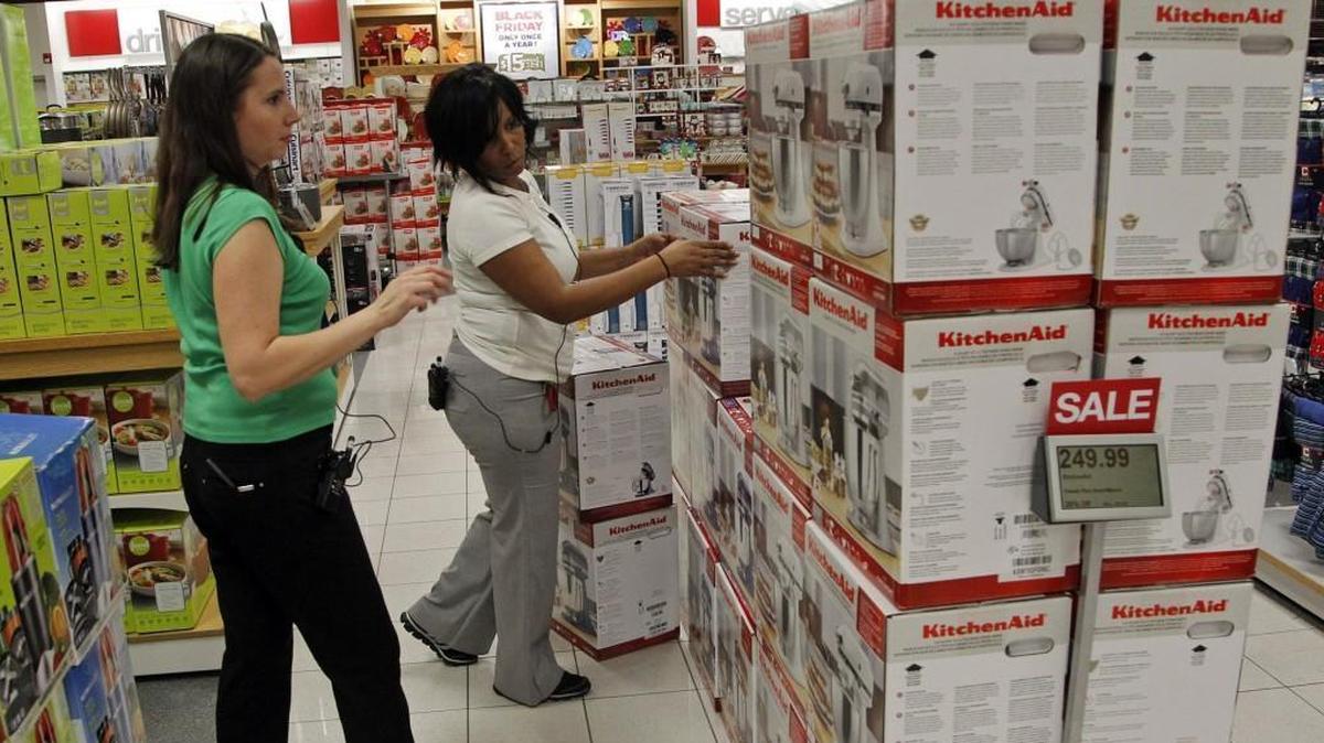 Employees at Kohl’s at Brier Creek Solvita Wallace, left, and Sandra Harvin prepare for Black Friday sales at the store in this 2014 file photo. This year the store opens at 5 p.m. on Thanksgiving.