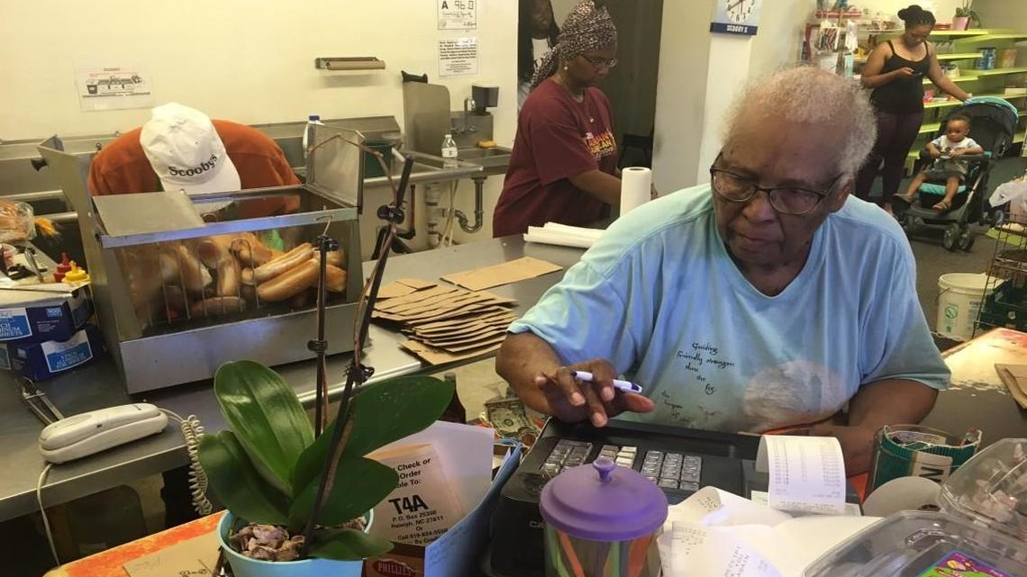 Anna Oates, 83, helps customers at Scooby’s on Sunday, July 31, 2017. It was the store’s last day.