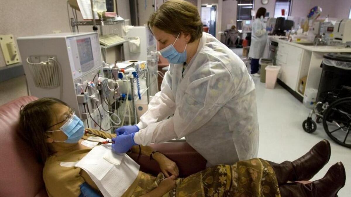 A patient gets help from a patient care technician at a DaVita dialysis facility in Durham. The company operates 72 dialysis centers in North Carolina. It now wants to move into Johnston County.