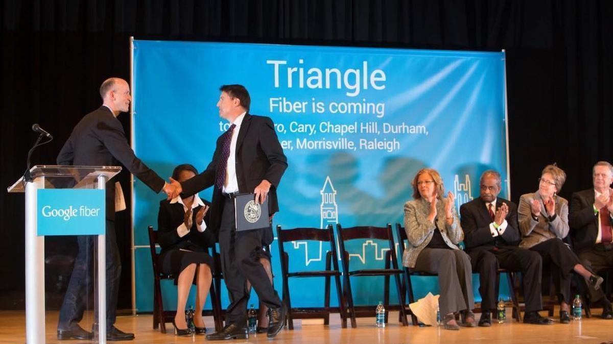 Michael Slinger, Google's director of fiber business operations, left, shakes hands with Gov. Pat McCrory during a press conference announcing plans to host gigabit broadband in Raleigh, Durham, Chapel Hill, Morrisville, Cary, Carrboro and Garner during a press conference Tuesday, January 27, 2015 at the N.C. Museum of History in Raleigh.