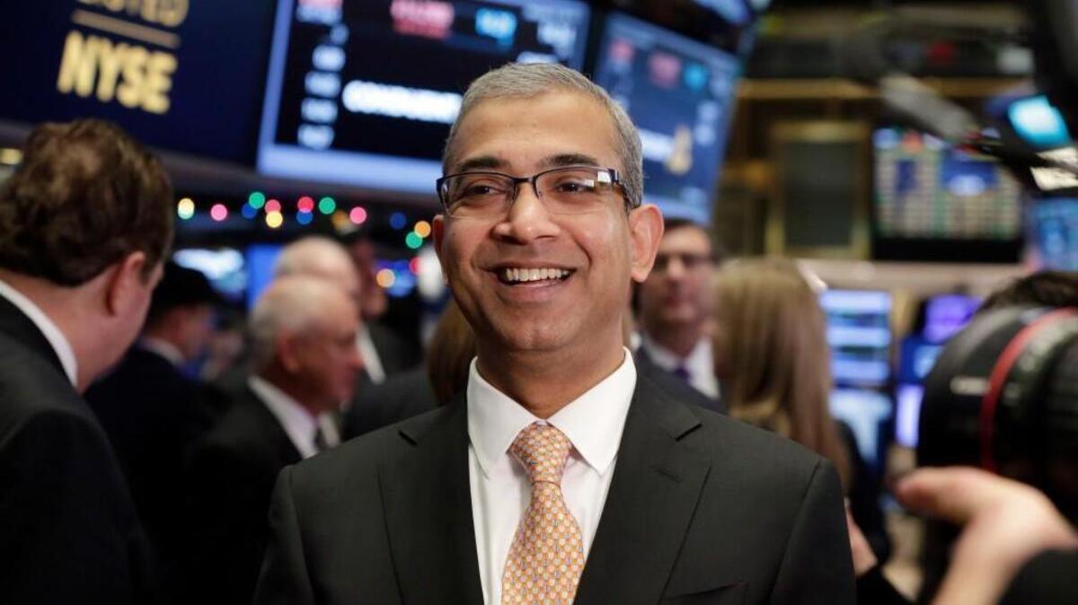 Conduent CEO Ashok Vemuri on the floor of the New York Stock Exchange in January 2017, after his company's spinoff from Xerox began trading. Conduent plans to hire 200 workers over the next three years at a global innovation hub it has planned for Wake County.