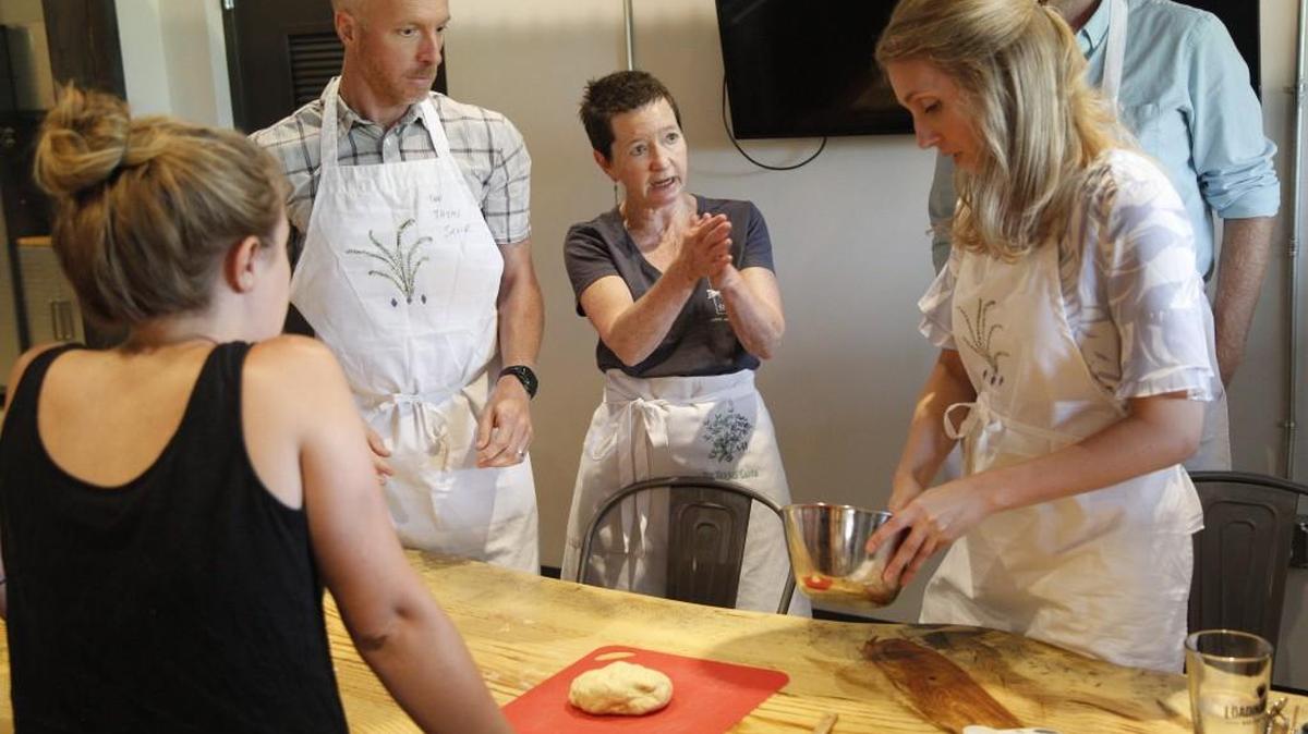 Cooking instructor Pamela Clark of the Thyme Savor, center, leads a class in pasta making Monday, June 12, 2017, at SkillPop, a business that offers pop-up classes in Raleigh and Charlotte.