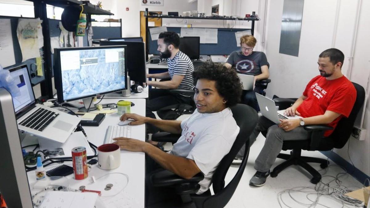 
Clockwise from front, Principled Technologies tech staffers Aaron Ward, Xander Madsen, Philip Ahlers and David Dieffenderfer finish up work just before the company's monthly lunch staff meeting Wednesday, October 7, 2015. Principled Technologies is a Durham technology marketing company focusing on technology products for large tech firms.
