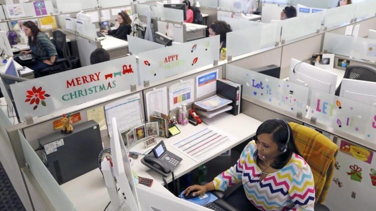 As health care costs soar for Blue Cross's ACA customers, the Chapel Hill insurer is cold-calling customers who use the ER as their go-to health care provider and setting up house calls to assess customers who don't have a primary care doctor. Here Tabitha Hawkins, right front, works in the Blue Cross "Situation Room" where about two dozen nurses and customer service reps call customers who are identified by the insurer's algorithm at the company offices in Durham, NC on Dec. 17, 2015.