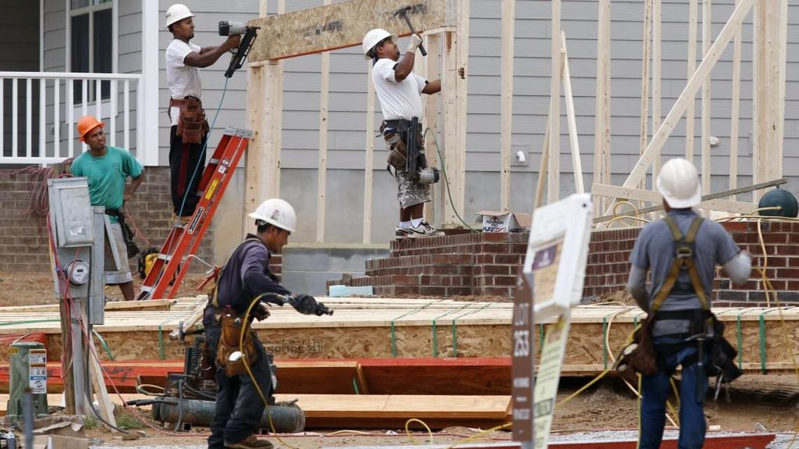 Construction workers swarm over a home site in the Wendell Falls subdivision in Wake County in this 2015 file photo. Finding skilled tradespeople has gotten harder and is leading to housing shortages.