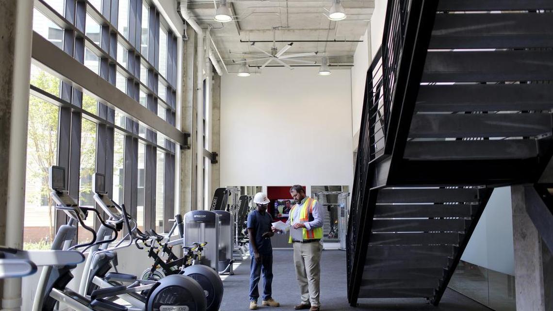 
From left, Antonio Cooper and Drew Sutton talk in the fitness center of the Stanhope Center student housing complex on Hillsborough Street on Thursday, August 6, 2015 in Raleigh, N.C.
